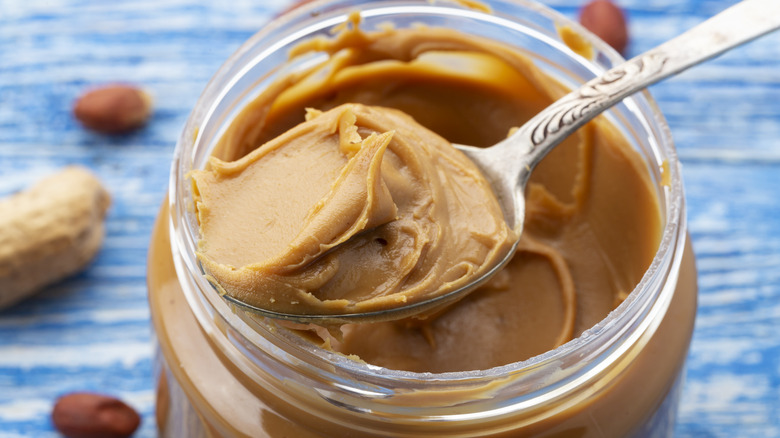 peanut butter spoon on jar