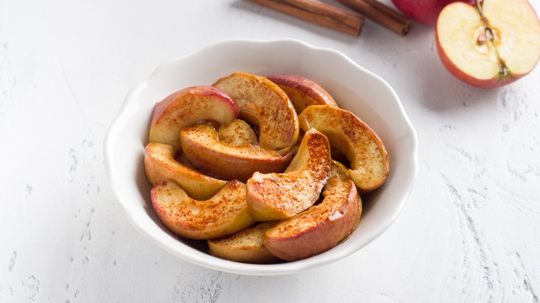 spiced apples in white bowl