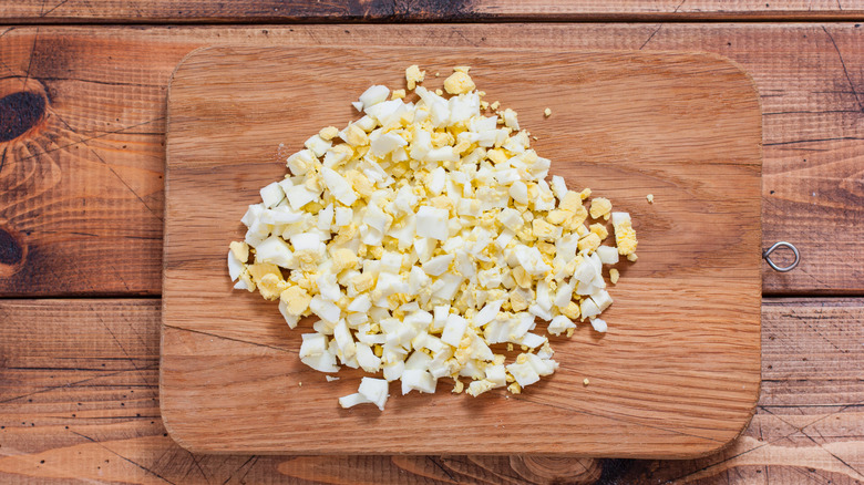 Chopped hard-boiled eggs on wood