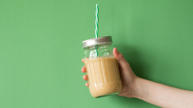 Peanut butter shake with straw