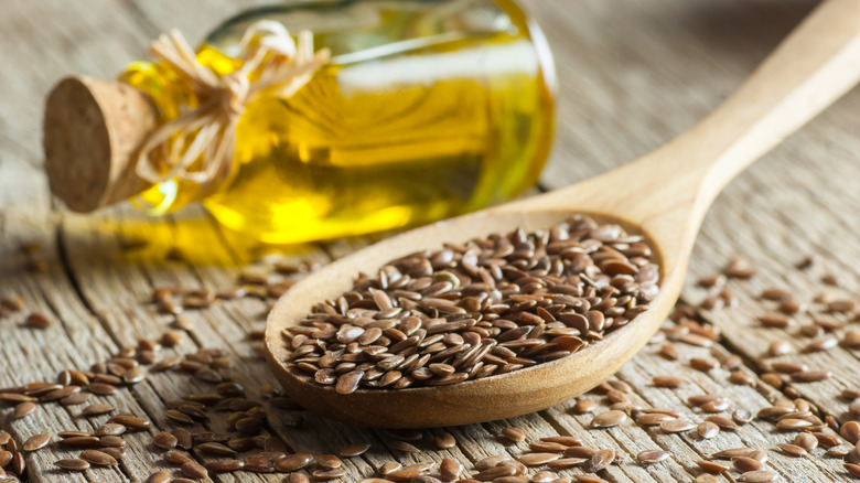 Pile of flaxseeds and oil