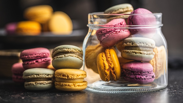 Colorful macarons in glass jar