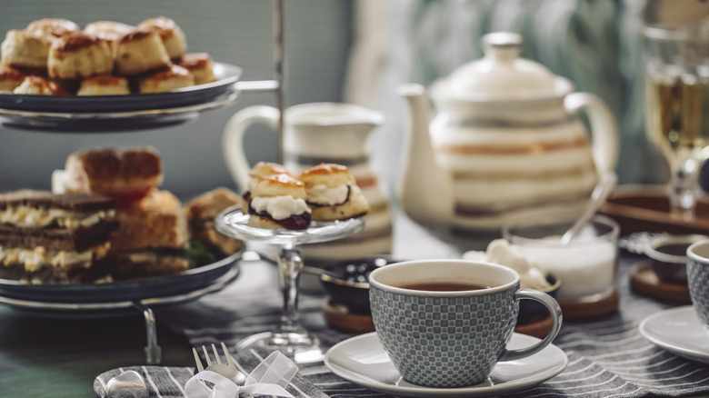 Tea and cakes on table