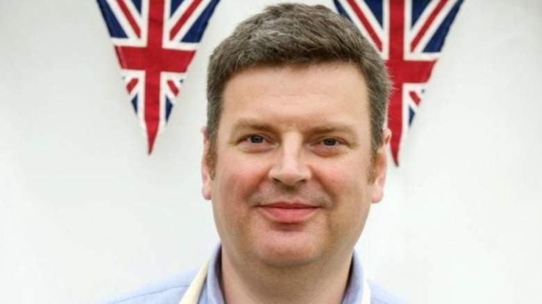 The Great British Bake Off Contestant Peter Maloney with Union Jack flags.