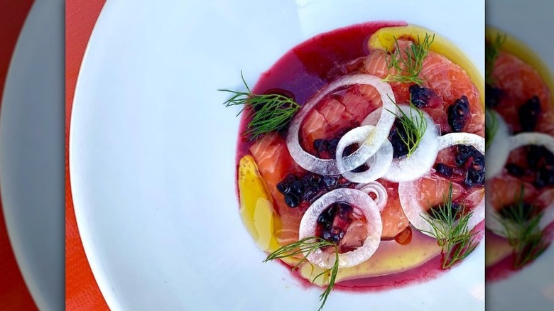 Salmon crudo with blackberries