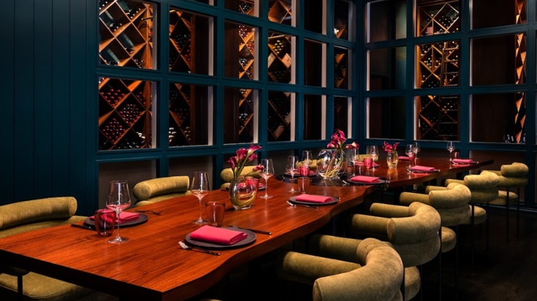 Knife Italian Steak private room with long table and plush dining chairs