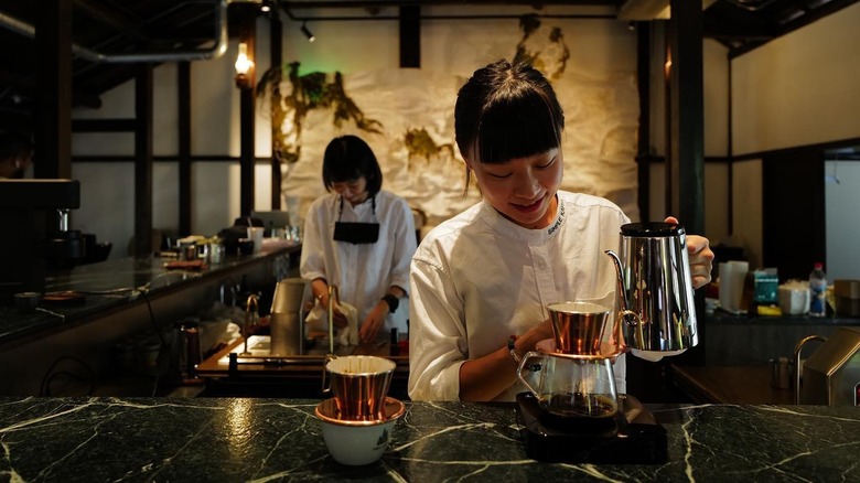 Simple Kaffa baristas making coffee