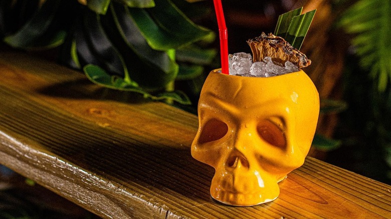 Tiki cocktail in skull mug