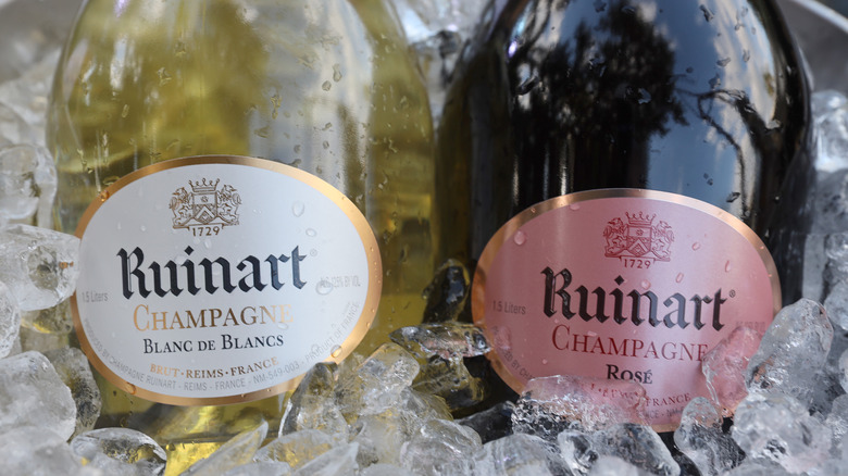 Ruinart Blanc de Blancs and Rosé bottles in ice