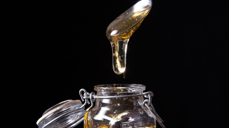 Agave nectar dripping from spoon