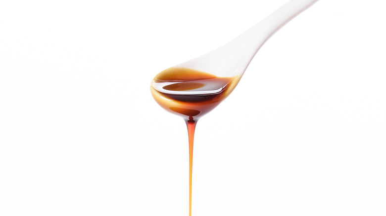 Pouring molasses from spoon