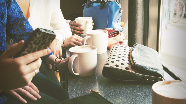 Several lattes on a table