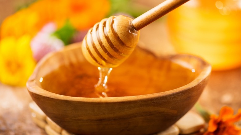 A wooden bowl of honey