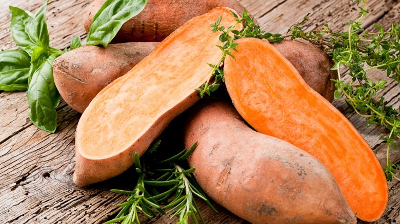 Halved and whole sweet potatoes