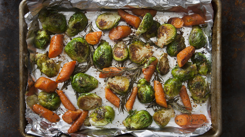 Carrots, Brussels sprouts on pan