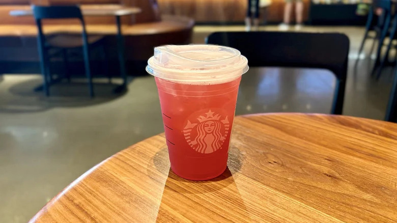 passion tango tea lemonade cup on a wooden table