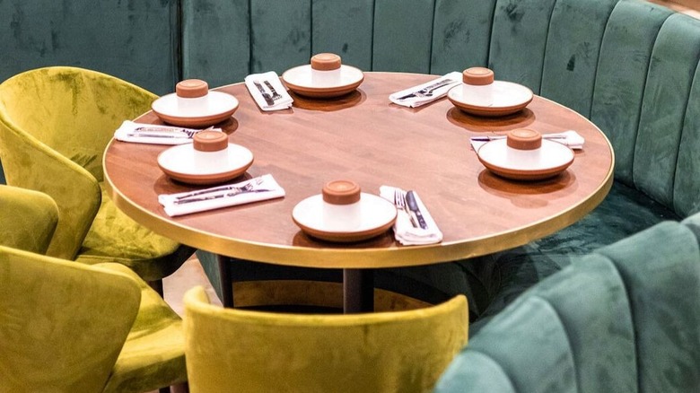 Restaurant banquette table and sliverware