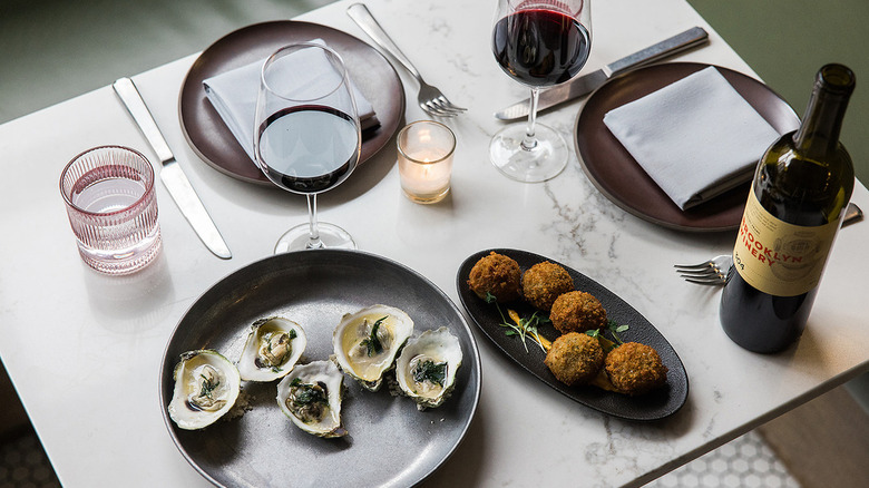 Plates and wine on table