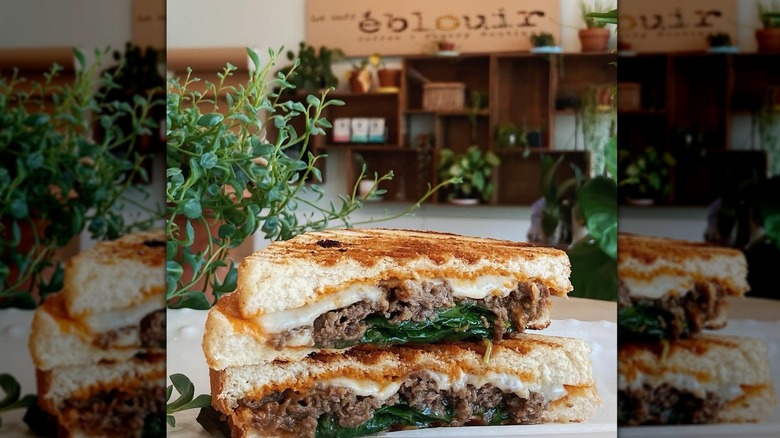 A sandwich in front of a storefront