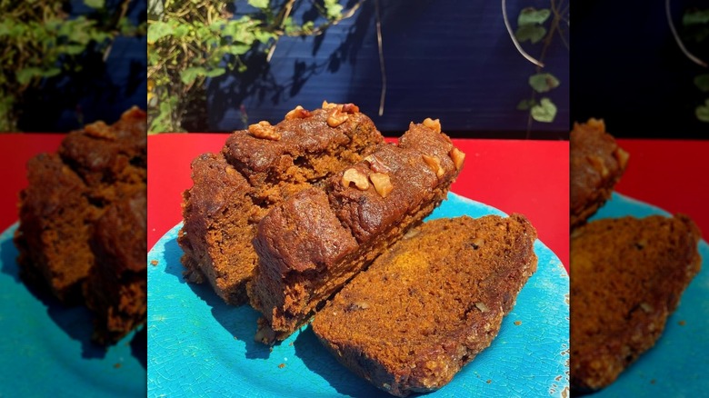 Orange pumpkin bread on a blue plate