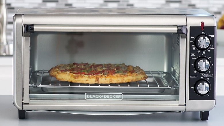 Black and Decker toaster oven with pizza inside