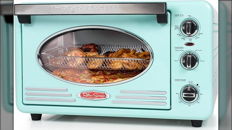 Blue Nostalgia toaster oven with food on two levels inside