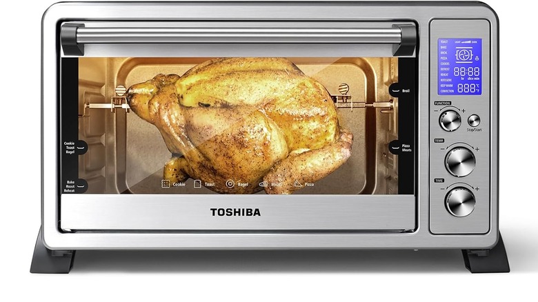 Toshiba 6-slice convection toaster oven with whole chicken roasting in it