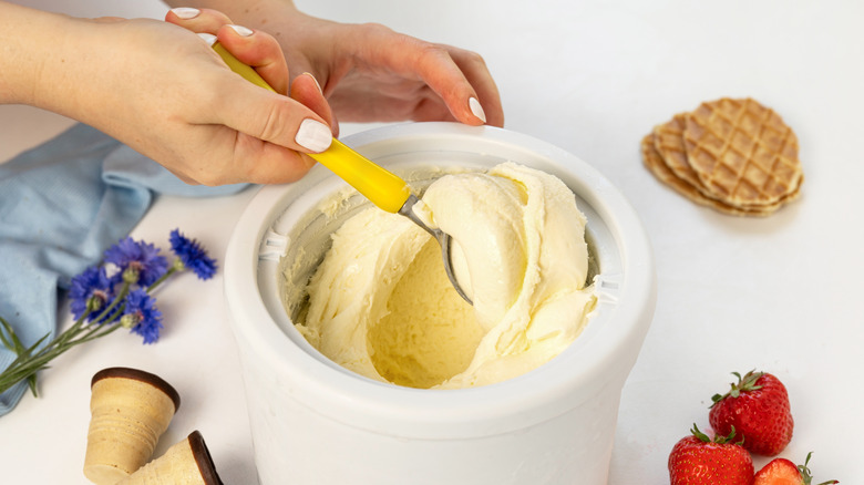 scooping ice cream from dish