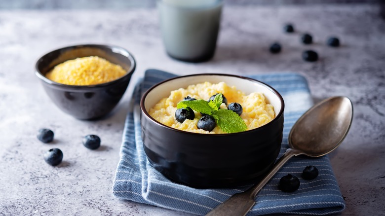 Polenta with milk and sugar topped with blueberries