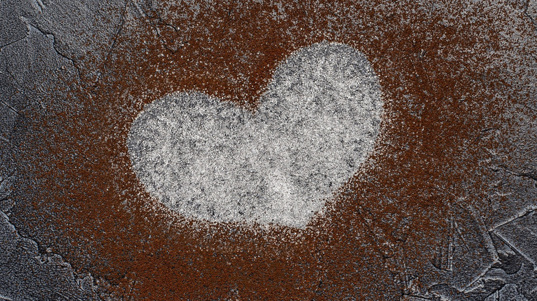 coffee grounds and salt in a heart shape