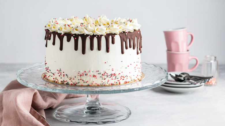 white cake on pedestal