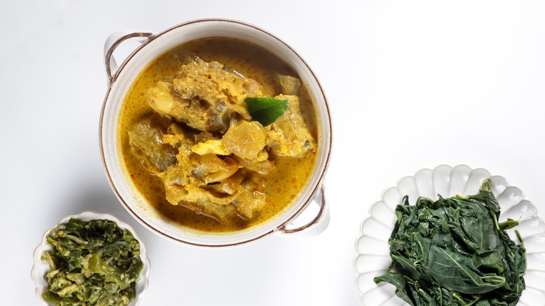 Indonesian Gulai kikil with vegetable sides