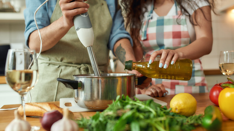 people using an immersion blender