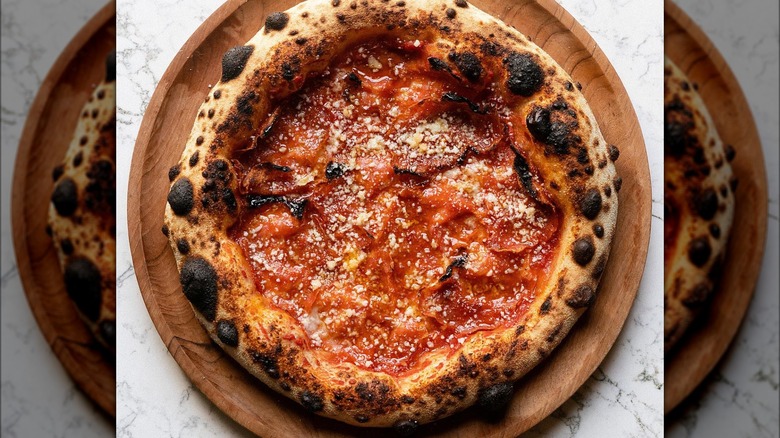 Soppressata pizza on wooden tray