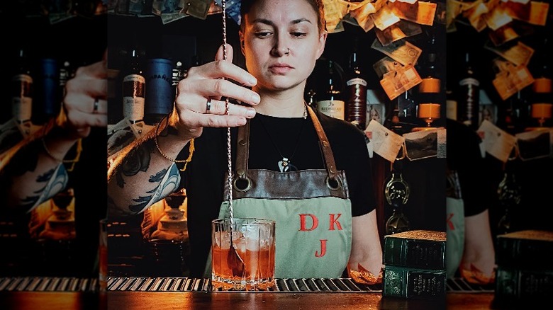 bartender stirring an old fashioned