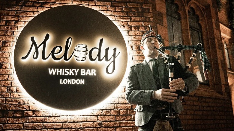 playing bagpipes, whisky bar sign
