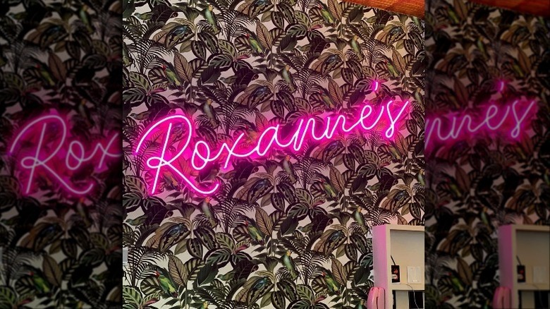 Roxanne's in neon pink letters