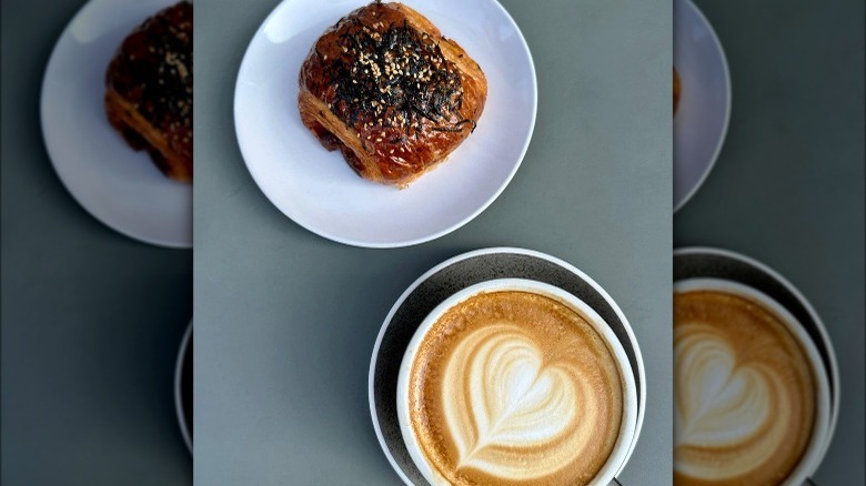 Coffee and croissant on plates