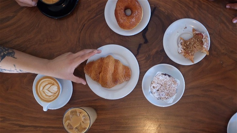 Table of pastries and coffees