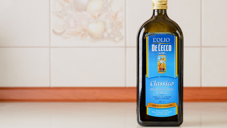 blue de cecco bottle with tile background