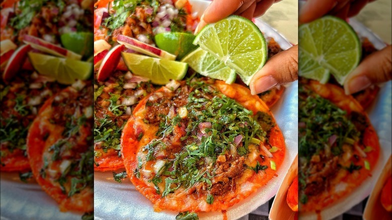 birria taco dunked into caldo broth