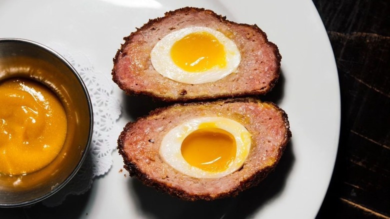 Scotch eggs with yellow sauce