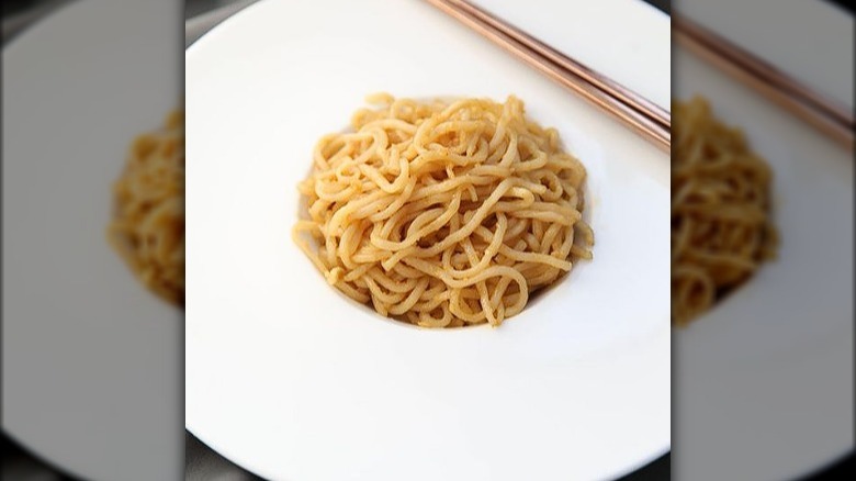 Plated garlic noodles from Crustacean