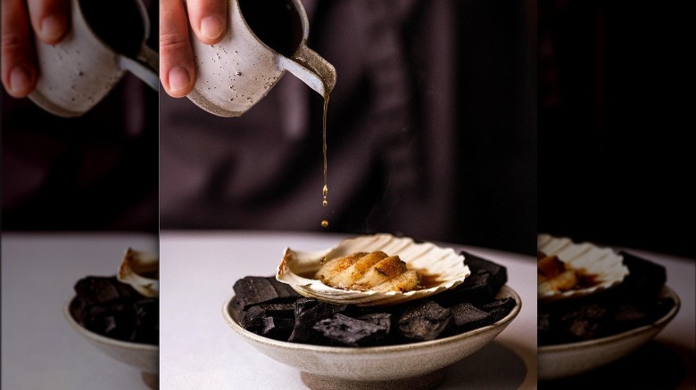 Sauce being poured on scallop