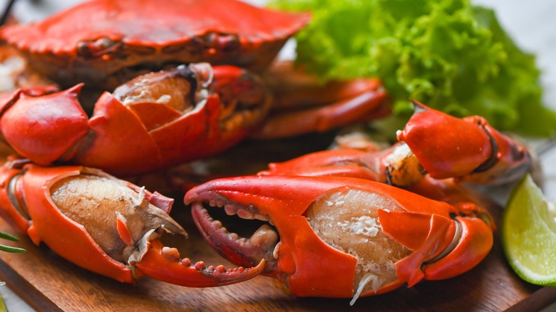 crab claws on cutting board