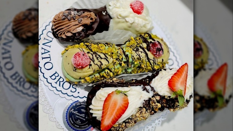 Three chocolate and pistachio cannoli 