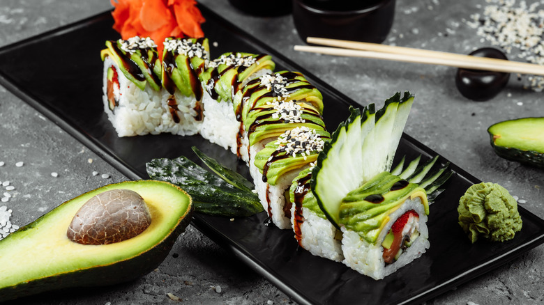 Dragon roll on black plate