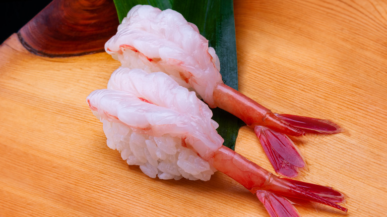 Shrimp nigiri on wood