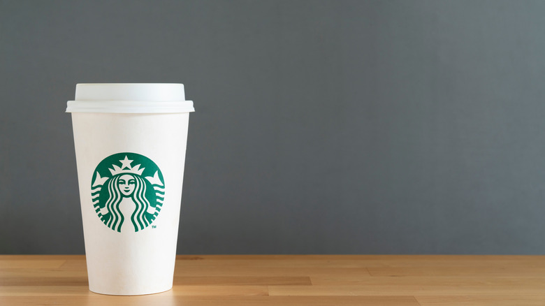 White Starbucks cup with lid