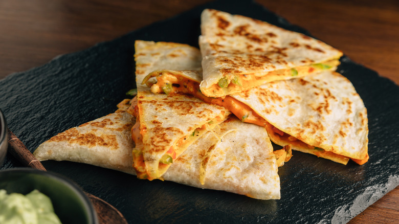 Stack of cheesy grilled quesadillas